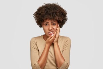 Patient experiencing tooth sensitivity to cold food and drinks